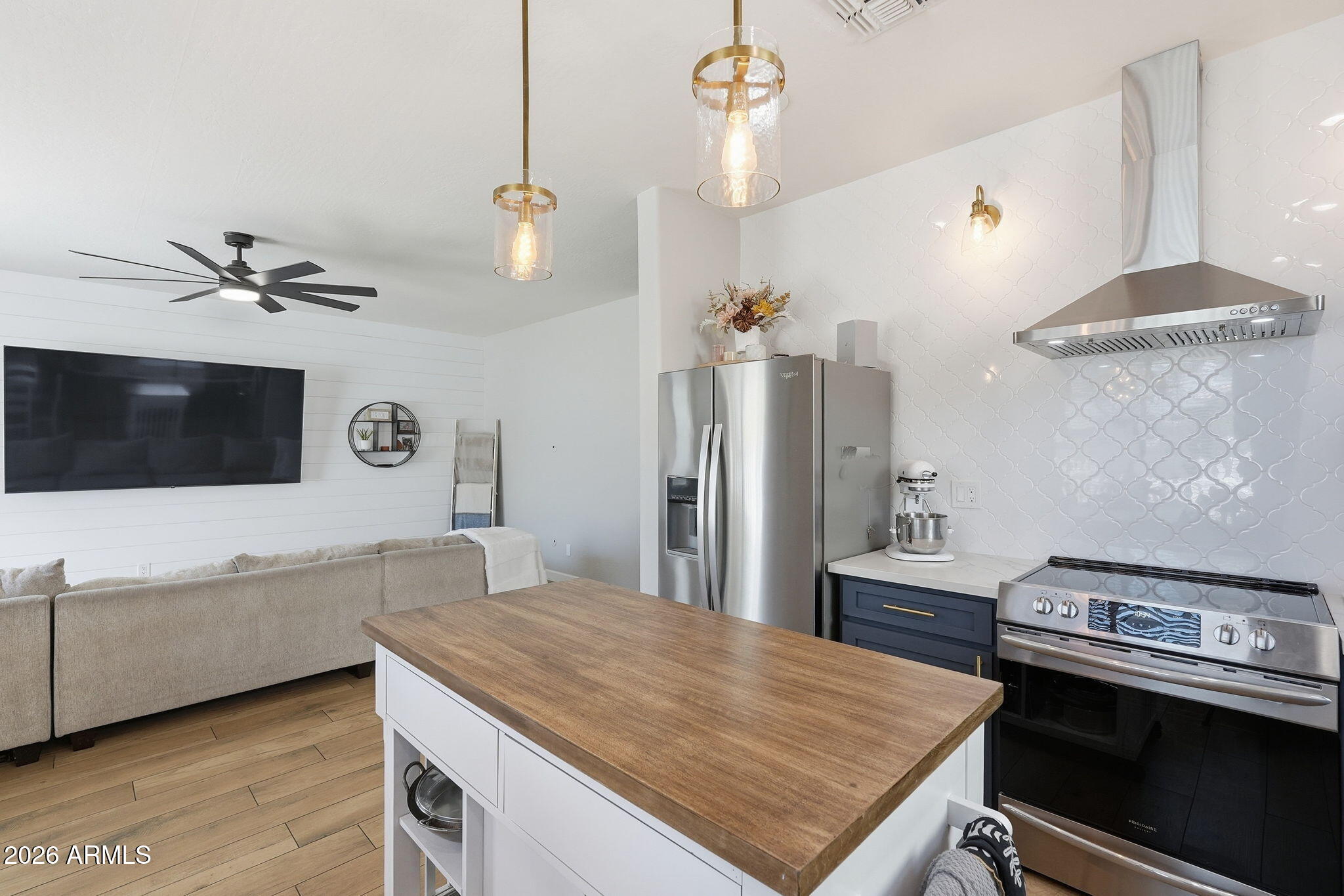 4184 East Trigger Way Gilbert, AZ 85297 - Photo 17 of 51 a kitchen with a stove and a wooden floor
