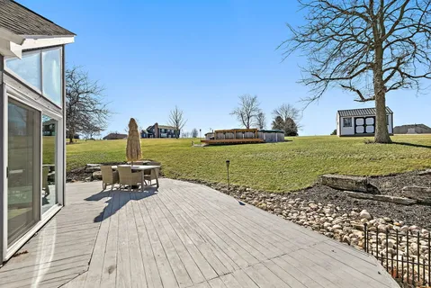 a view of a patio with a yard