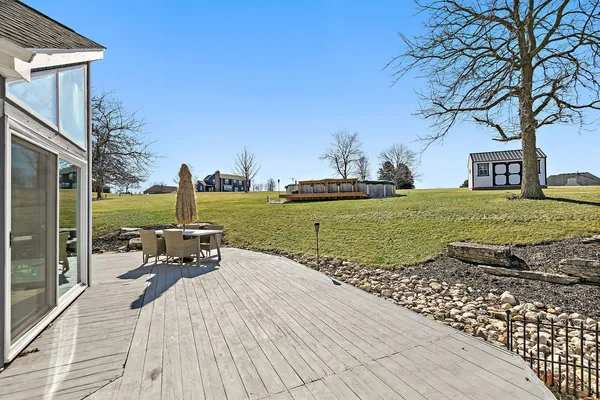 a view of a patio with a yard
