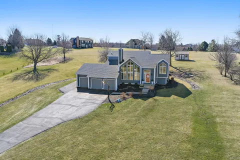 a view of a house with outdoor space and lake view