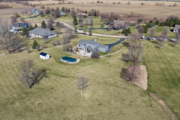 an aerial view of residential houses with outdoor space