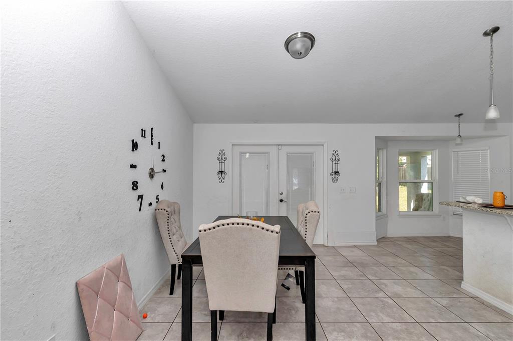 7153 Southeast 124th Street Belleview, FL 34420 - Photo 17 of 22 a view of a room with furniture and wooden floor