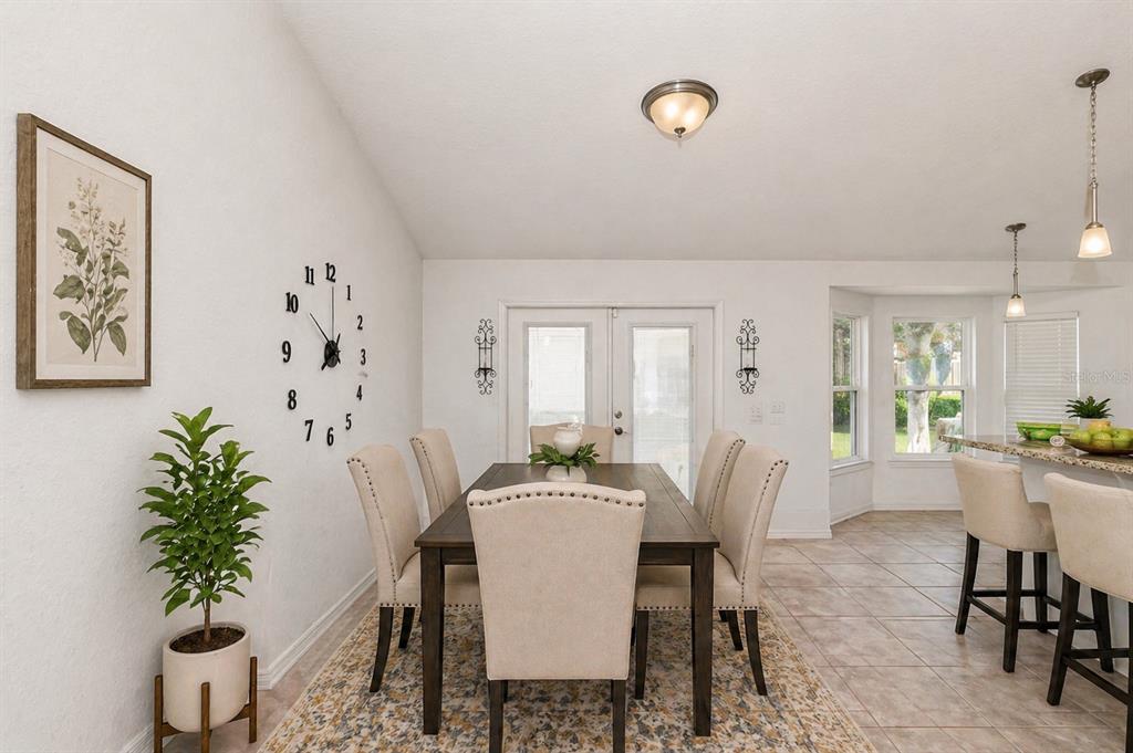 7153 Southeast 124th Street Belleview, FL 34420 - Photo 5 of 16 a dining room with furniture and window