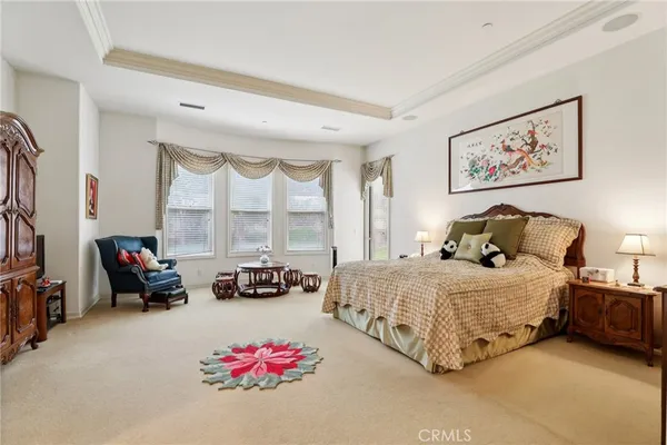 a bedroom with a bed and a couch