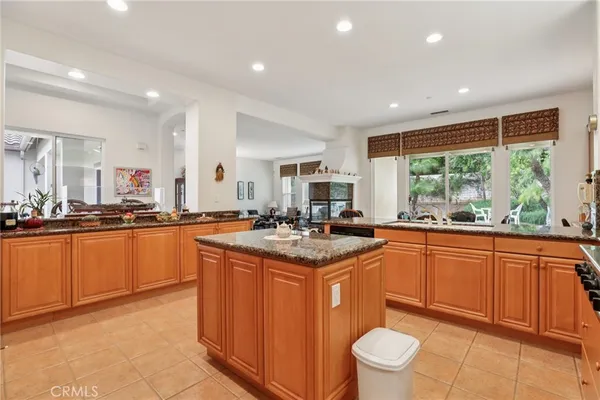 a kitchen with stainless steel appliances granite countertop sink stove and cabinets