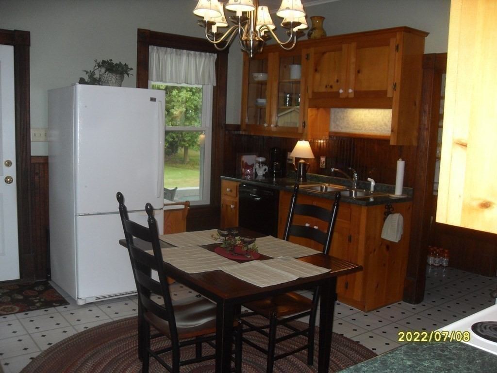 554 Rock Valley Road Holyoke, MA 01040 - Photo 11 of 41 a view of a dining room with furniture and chandelier