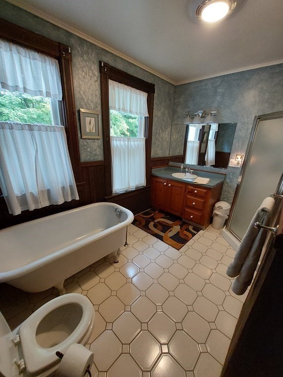 554 Rock Valley Road Holyoke, MA 01040 - Photo 17 of 41 a living room with furniture and a floor to ceiling window