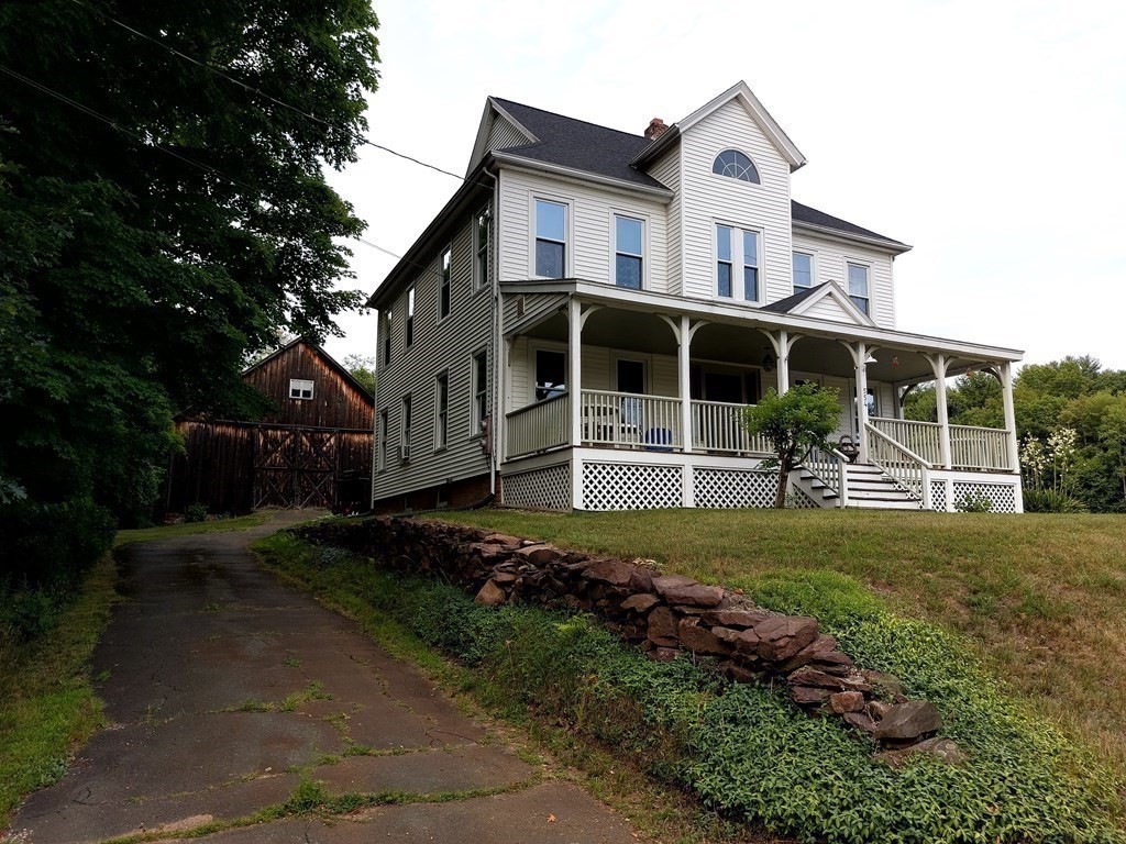 554 Rock Valley Road Holyoke, MA 01040 - Photo 3 of 41 a front view of a house with a yard