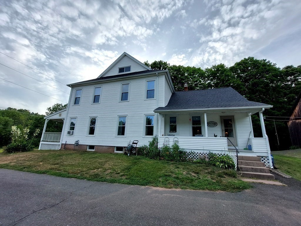 554 Rock Valley Road Holyoke, MA 01040 - Photo 5 of 41 a front view of a house with garden