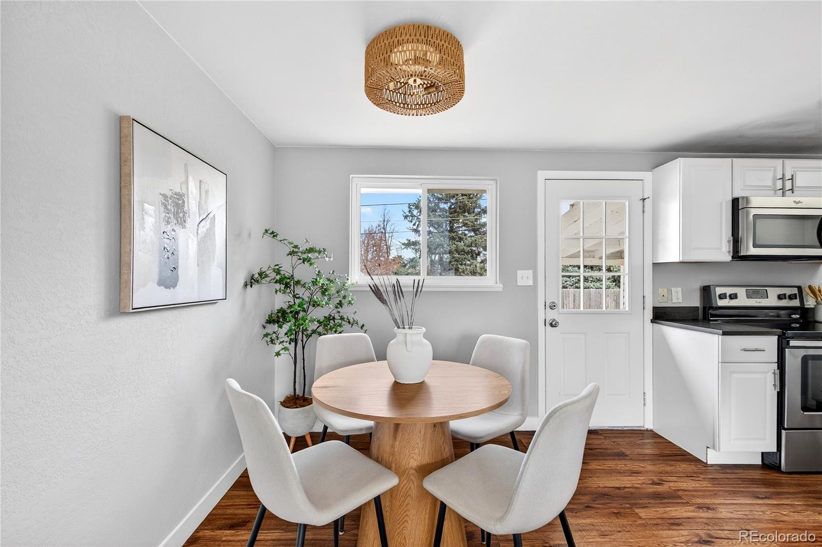 5246 Pierce Street Arvada, CO 80002 - Photo 21 of 30 a dining room with furniture and window