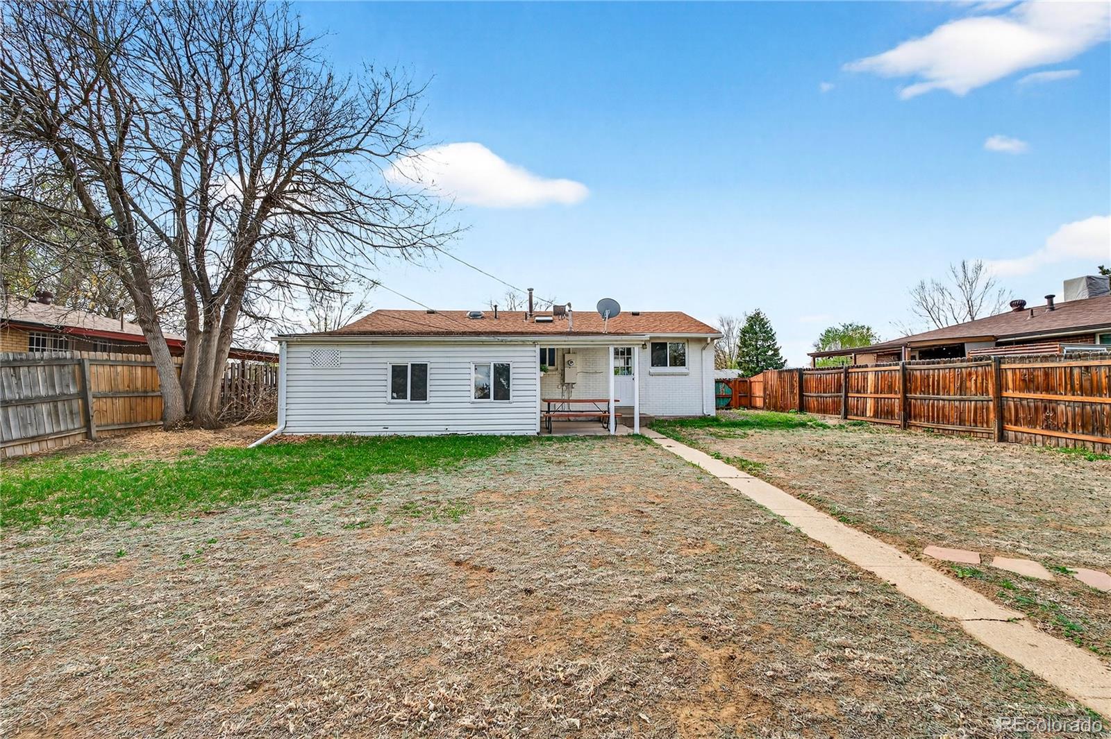 5246 Pierce Street Arvada, CO 80002 - Photo 27 of 30 a view of a house with a backyard