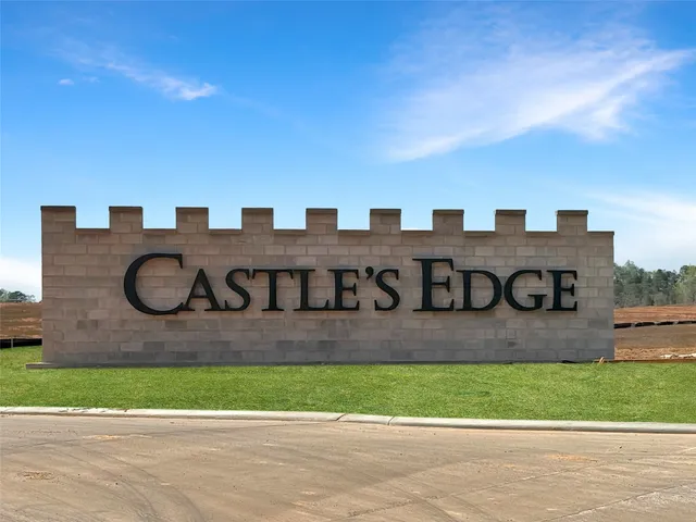 a view of a street with a building in the background