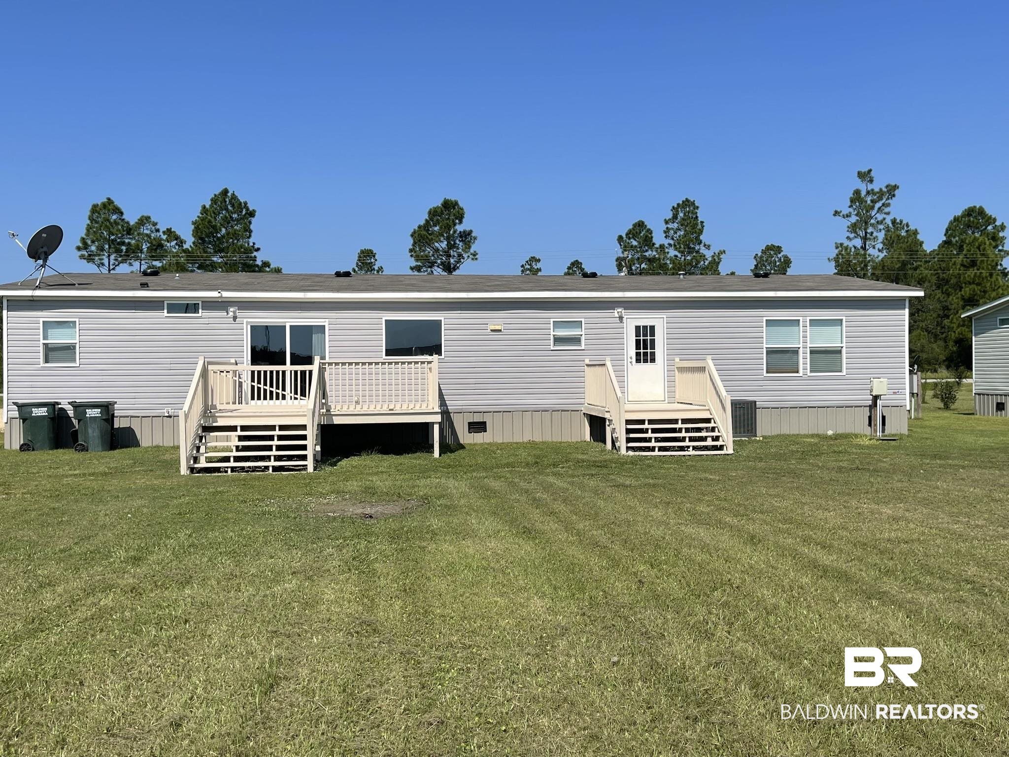 16802 County Road 87 Elberta, AL 36530 - Photo 19 of 19 Back of house with a lawn and a deck