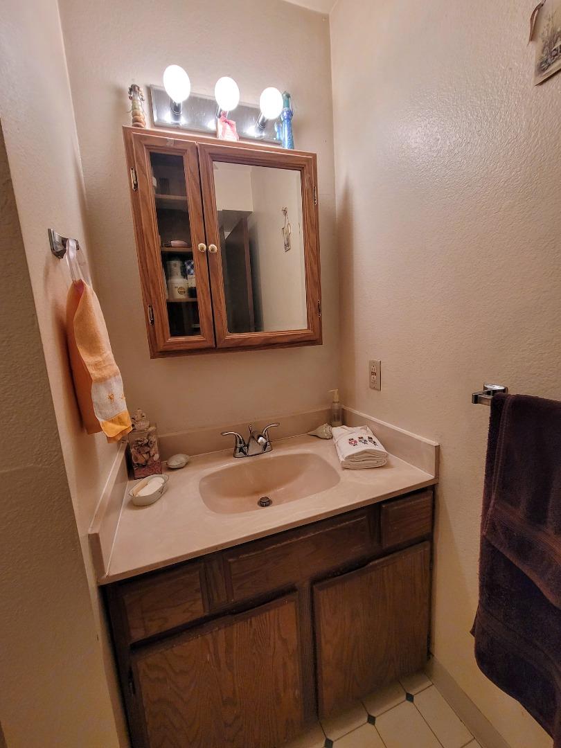 947 Ridgeview Court, Unit C South San Francisco, CA 94080 - Photo 16 of 26 a bathroom with a sink and a mirror