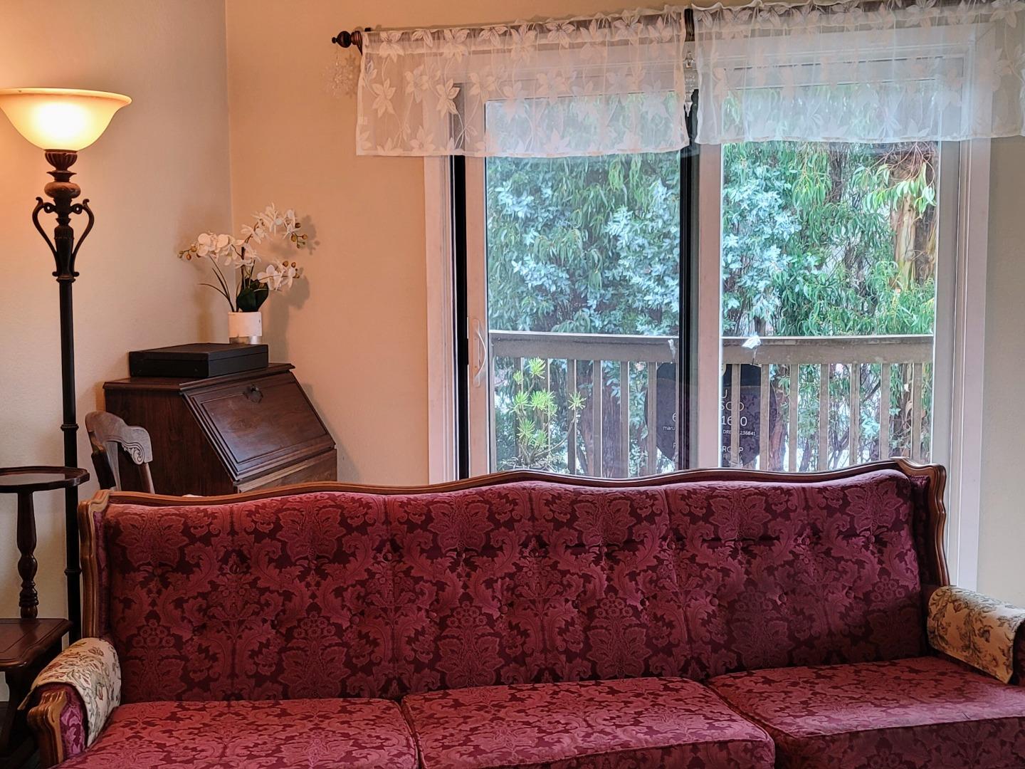 947 Ridgeview Court, Unit C South San Francisco, CA 94080 - Photo 2 of 26 a living room with furniture and a large window