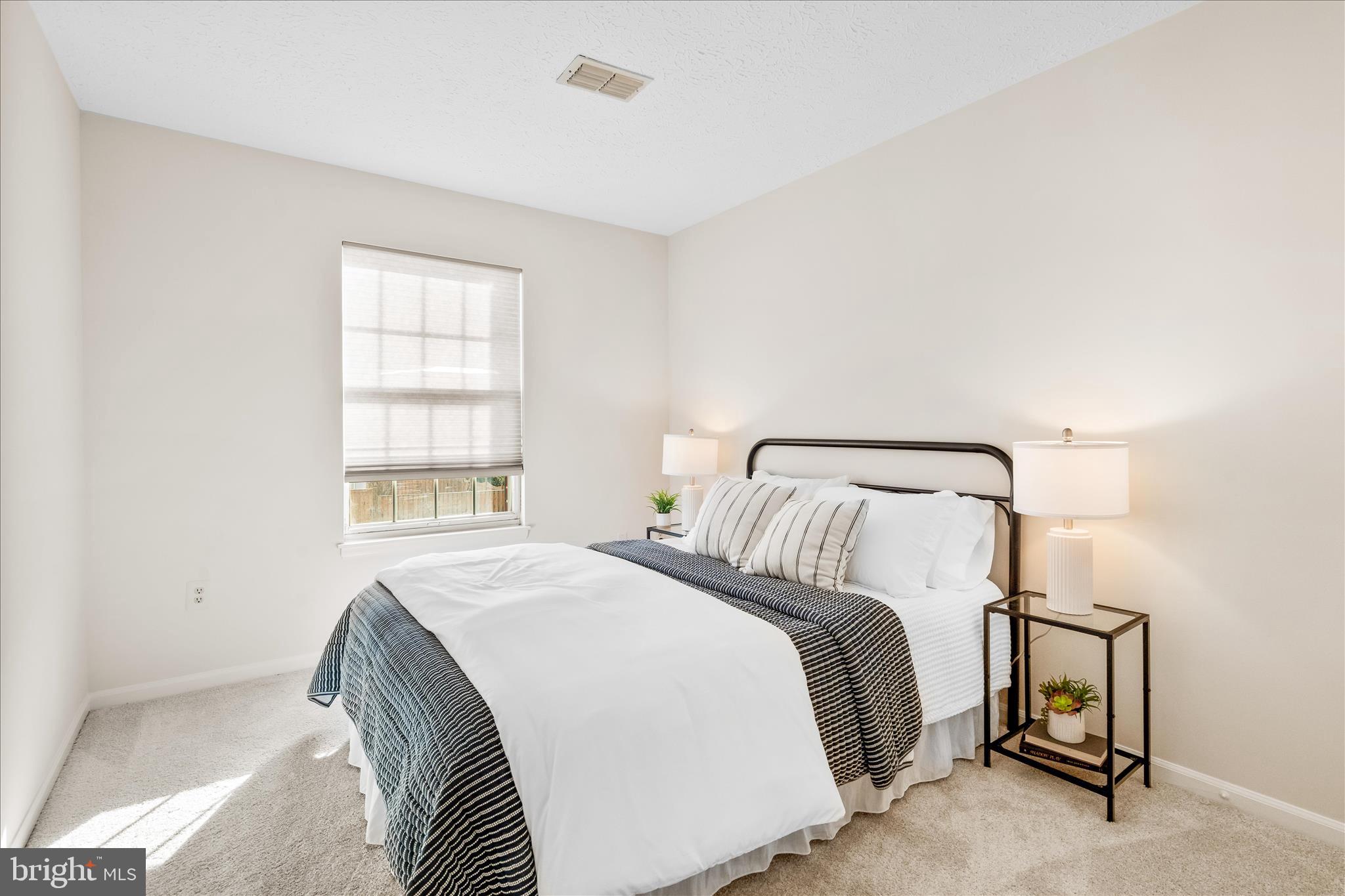 5306 Regal Court Frederick, MD 21703 - Photo 14 of 17 a bedroom with a bed and a window