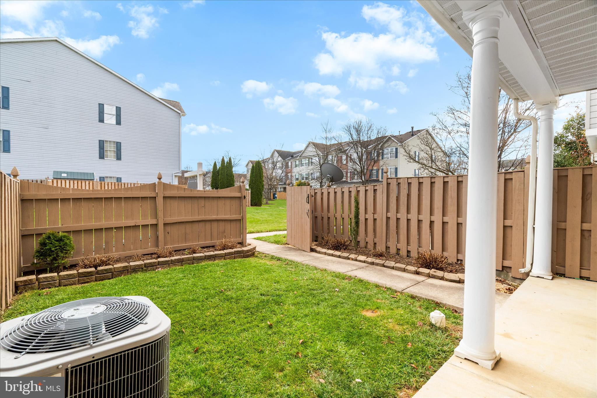 5306 Regal Court Frederick, MD 21703 - Photo 16 of 17 a view of a backyard with a tub and wooden fence