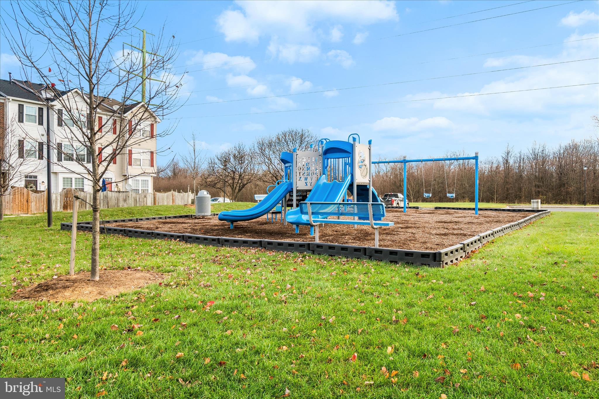 5306 Regal Court Frederick, MD 21703 - Photo 17 of 17 a view of a park with swings and slides
