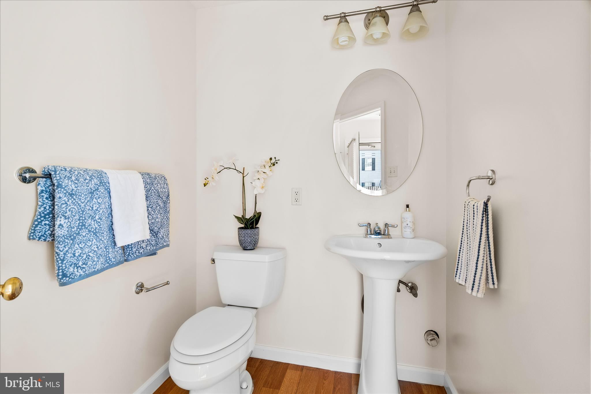 5306 Regal Court Frederick, MD 21703 - Photo 8 of 17 a bathroom with a toilet a sink and a mirror