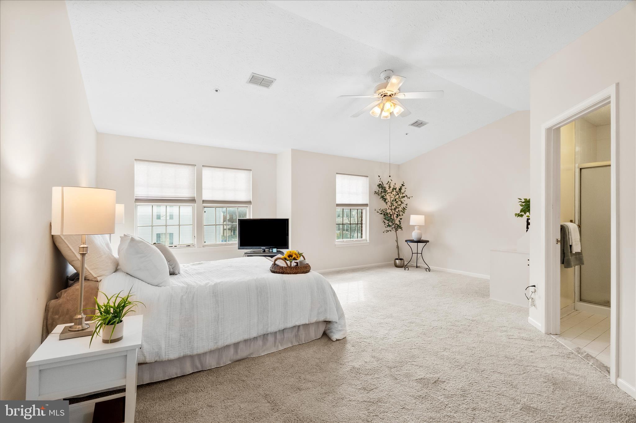 5306 Regal Court Frederick, MD 21703 - Photo 10 of 17 a bedroom with a bed couch and window