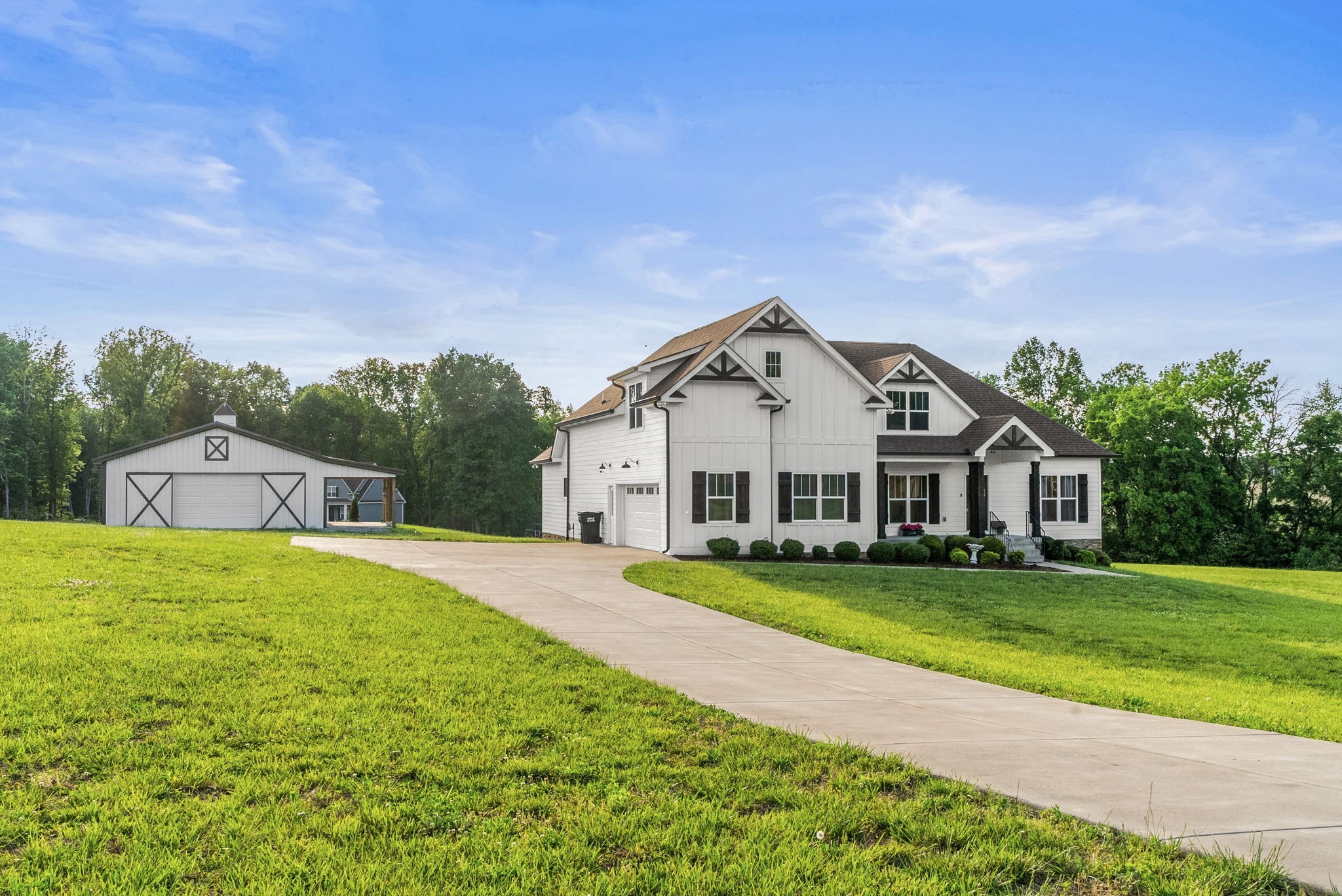 3378 New Hall Road Greenbrier, TN 37073 - Photo 11 of 83 a view of a white house with a big yard and large trees
