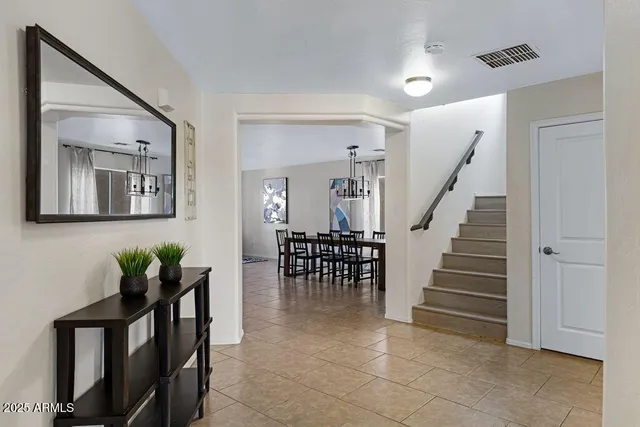 a view of a livingroom with furniture and a potted plant