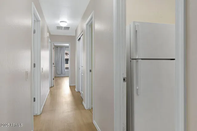 a bathroom with a glass door shower