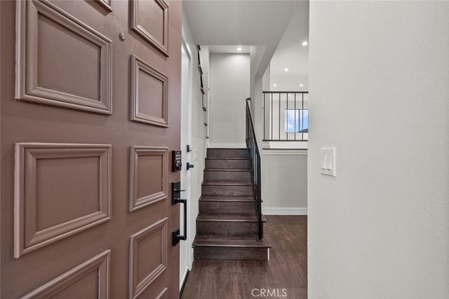 a view of entryway with wooden floor