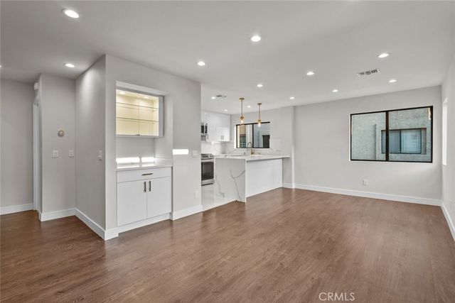 a view of kitchen with wooden floor