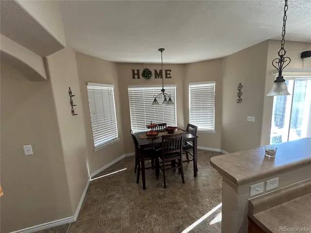 a view of a dining room with furniture