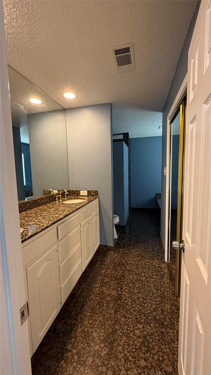 124 Villanova Circle Forney, TX 75126 - Photo 14 of 14 a bathroom with a sink and a mirror