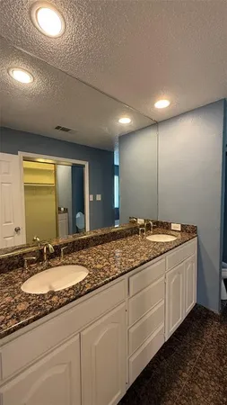 an empty room with a ceiling fan and a window