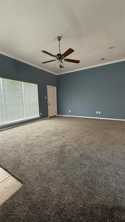 124 Villanova Circle Forney, TX 75126 - Photo 9 of 14 an empty room with a ceiling fan and a window