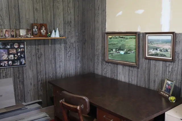 a room with a wooden floor and a table