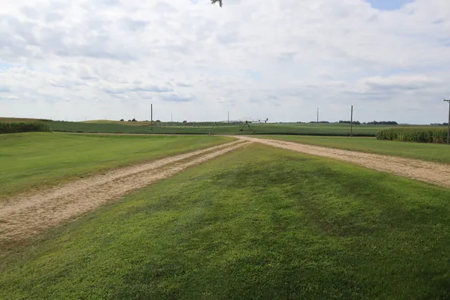 a view of a lake with houses in the back