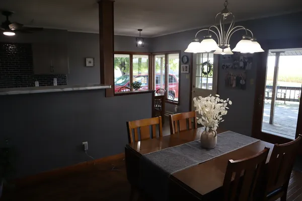 a view of a dining room with furniture and window