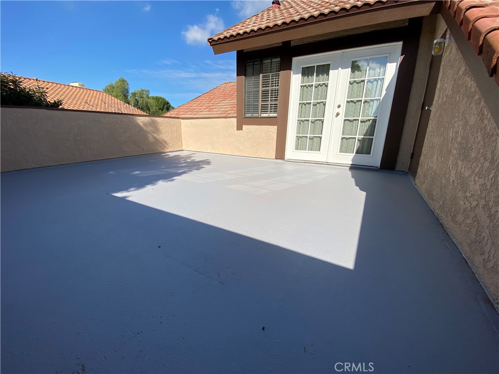 9 Skyline Lane Phillips Ranch, CA 91766 - Photo 9 of 12 a view of an empty room with wooden floor and a window