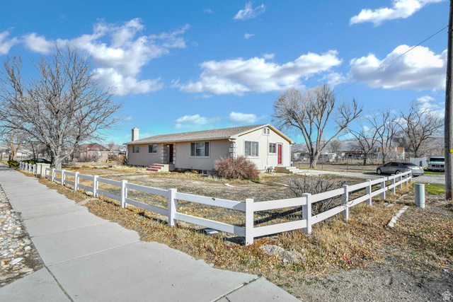 10 North Main Street Centerfield, UT 84622 - Photo 44 of 52 Ranch-style home with a fenced front yard, stucco siding, a chimney, and entry steps