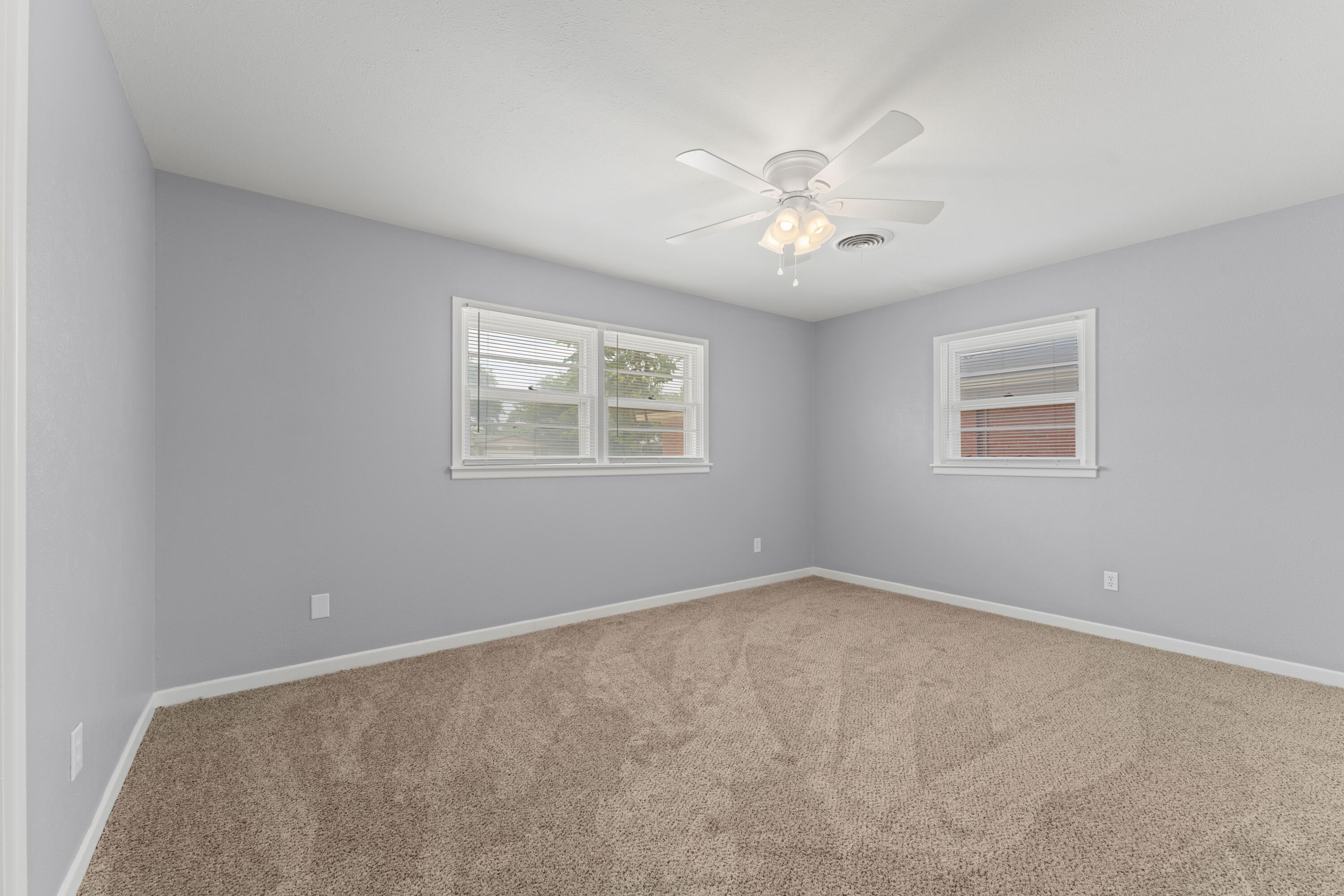 4609 31st Street Lubbock, TX 79410 - Photo 13 of 21 a view of an empty room with a window