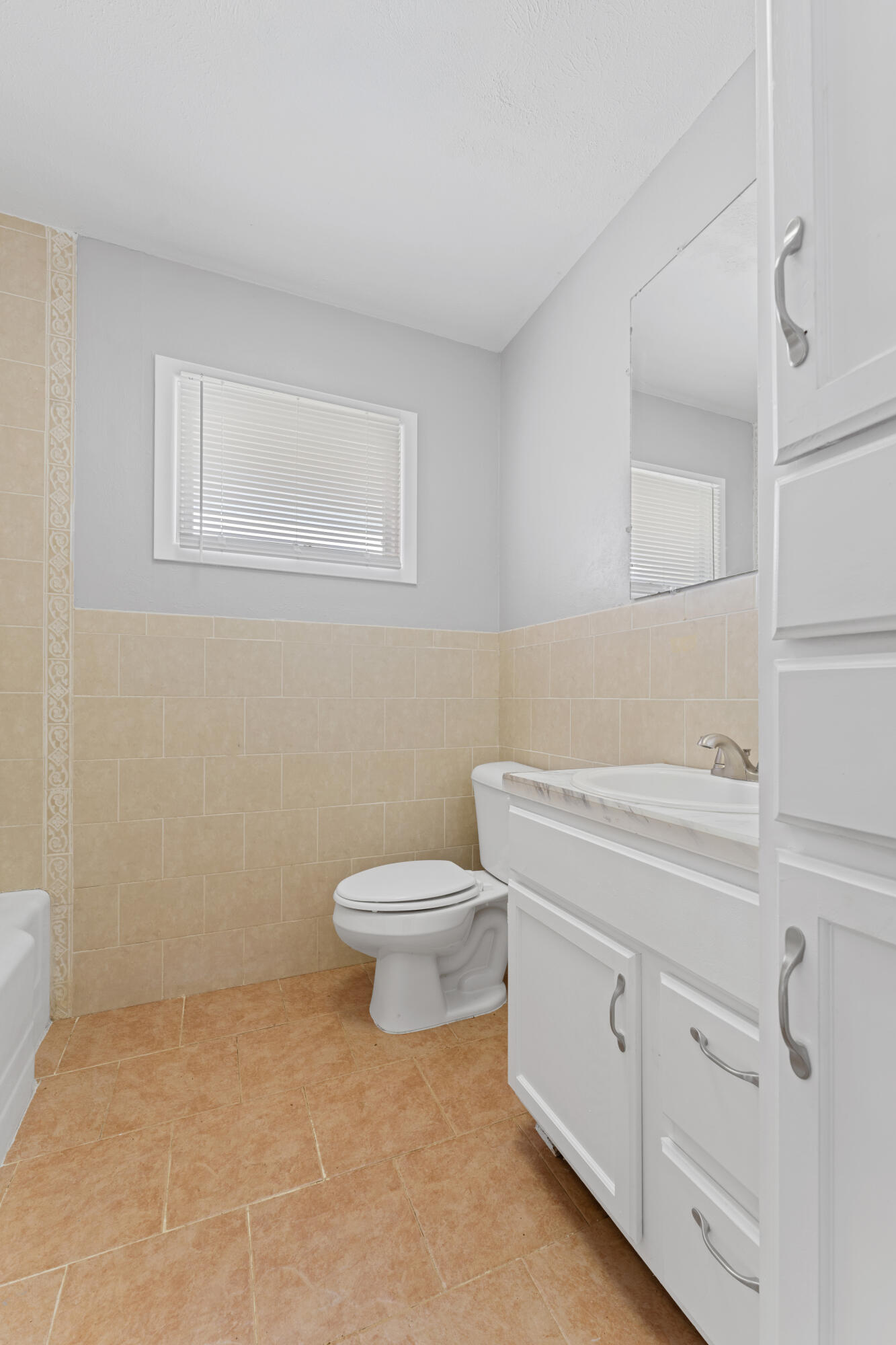 4609 31st Street Lubbock, TX 79410 - Photo 15 of 21 a bathroom with a toilet sink