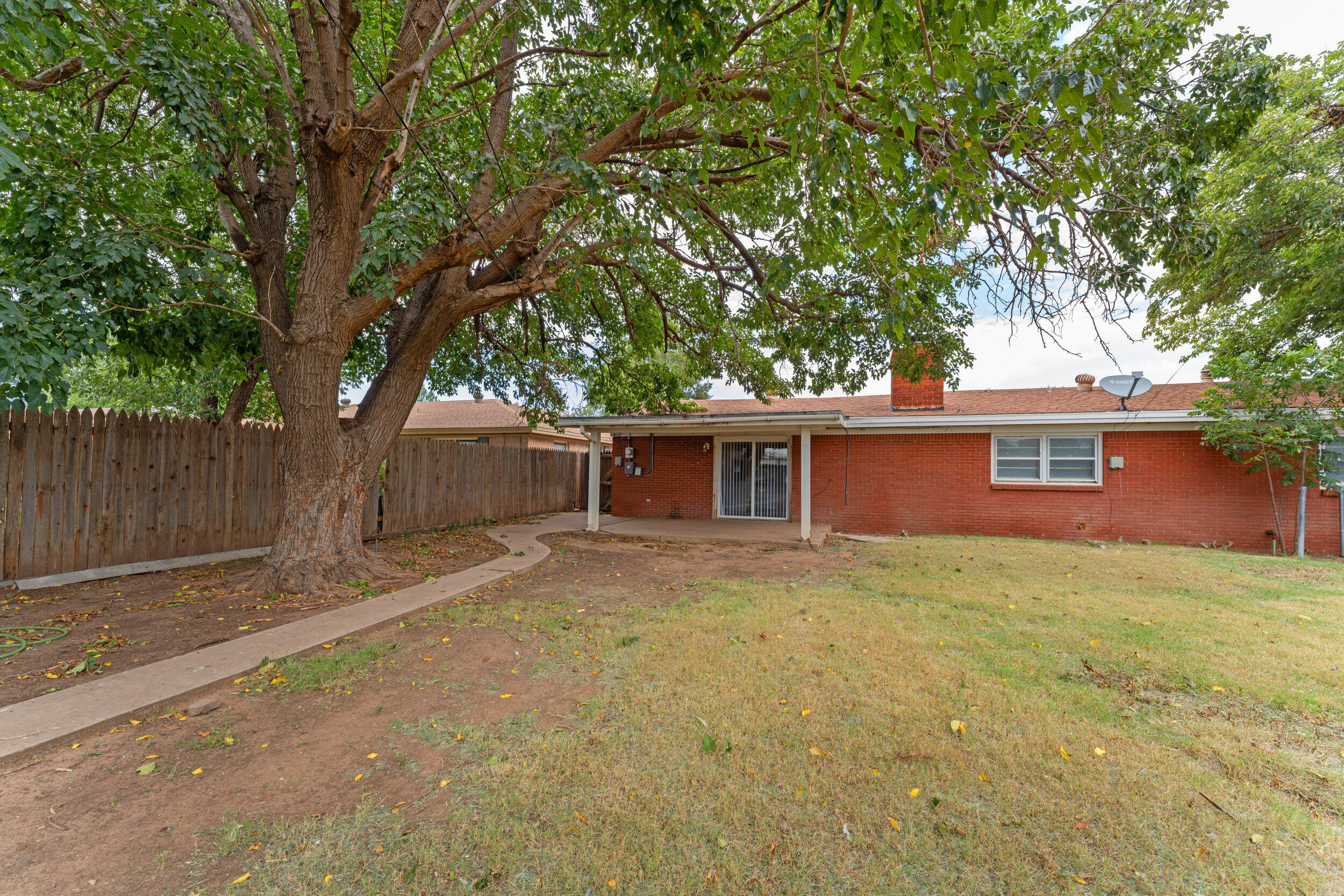 4609 31st Street Lubbock, TX 79410 - Photo 20 of 21 a house that has a tree in front of it