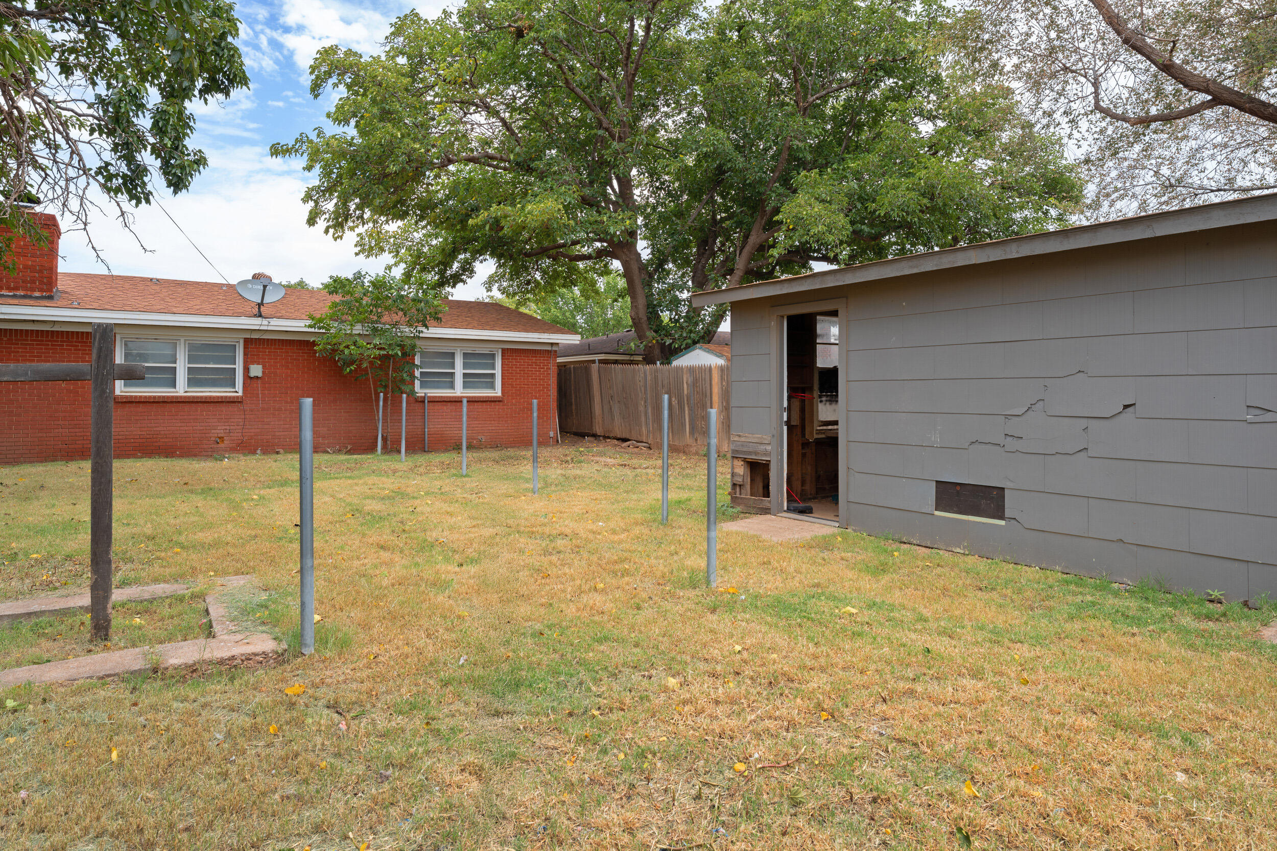 4609 31st Street Lubbock, TX 79410 - Photo 21 of 21 a backyard of a house with table and chairs
