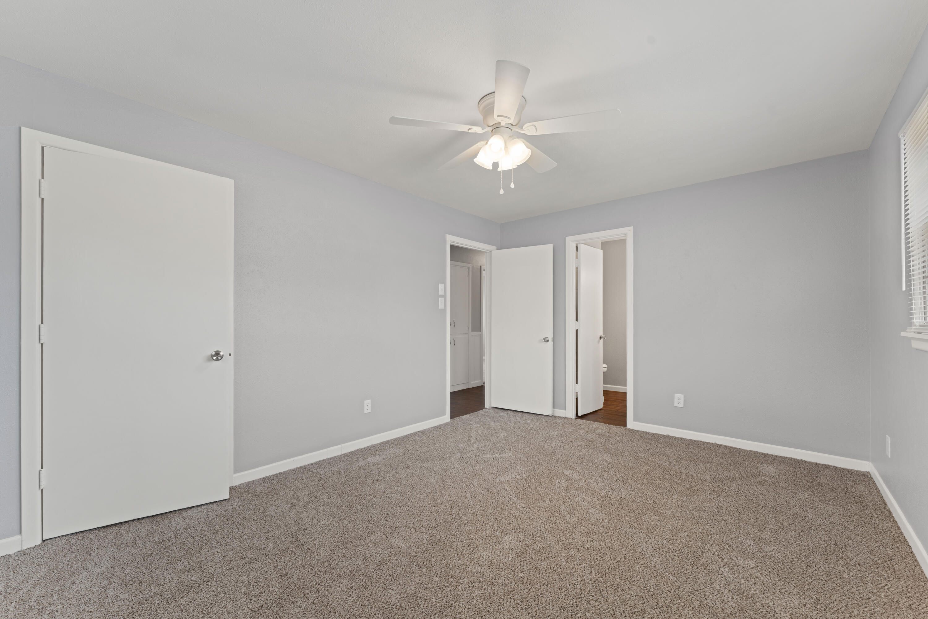 4609 31st Street Lubbock, TX 79410 - Photo 4 of 21 a view of an empty room with a fan