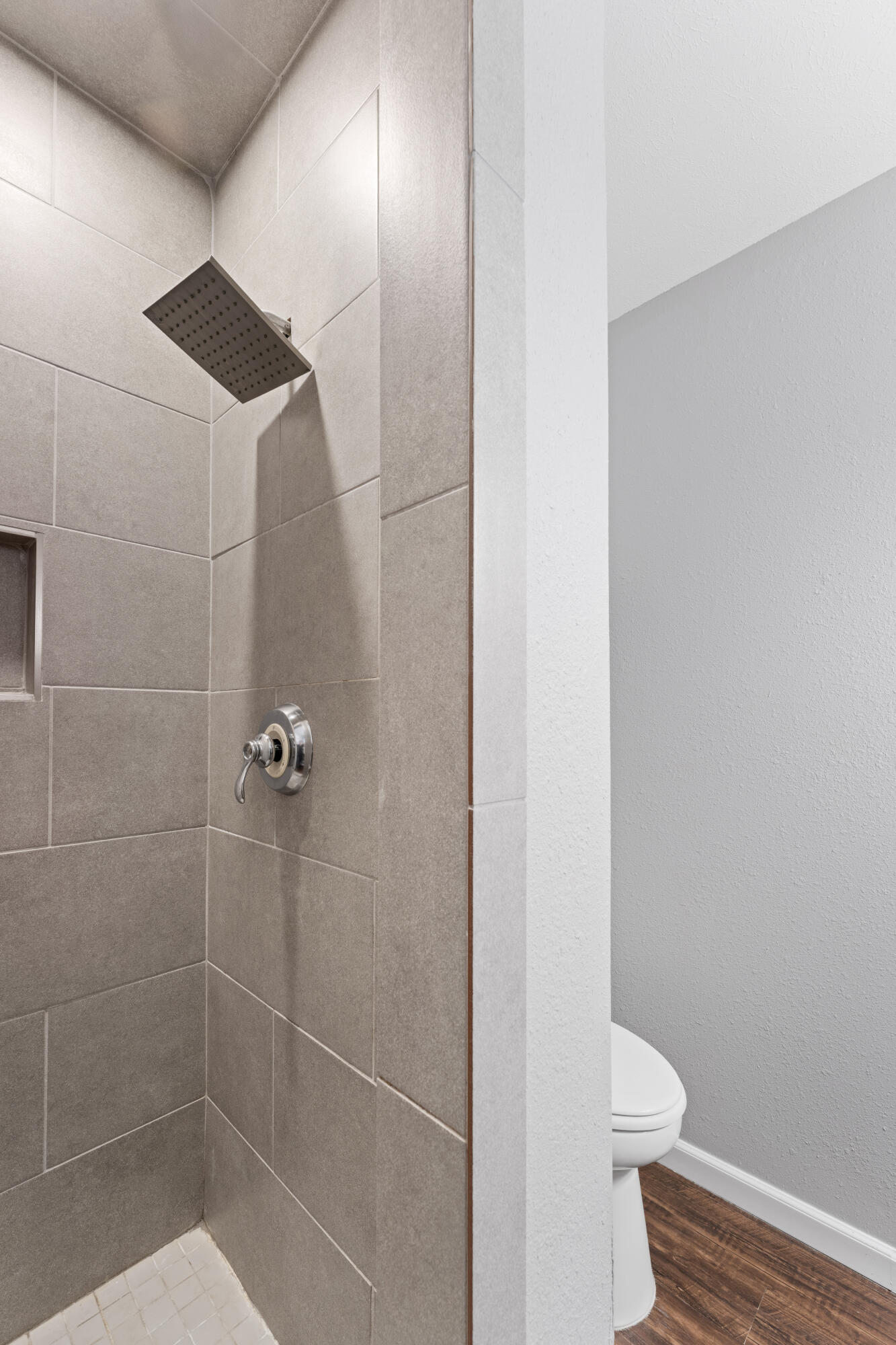 4609 31st Street Lubbock, TX 79410 - Photo 5 of 21 a bathroom with a shower and a toilet
