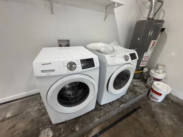 a utility room with dryer and washer