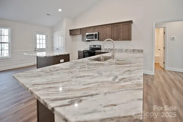 a large white bed in a white room