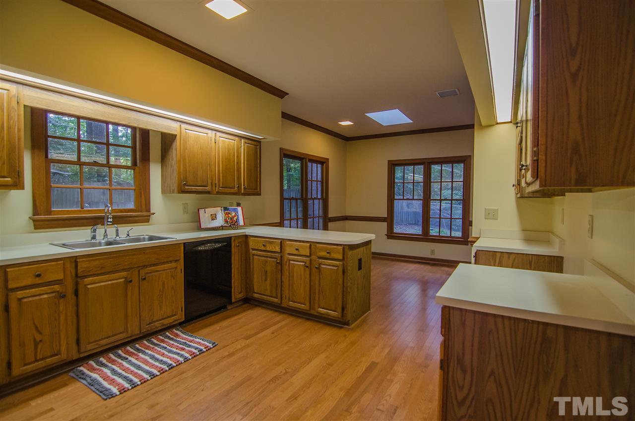 1301 Cool Spring Road Raleigh, NC 27614 - Photo 11 of 25 Another view showing the breakfast area off the kitchen. This room opens to the family room. Notice the wood floors and molding.
