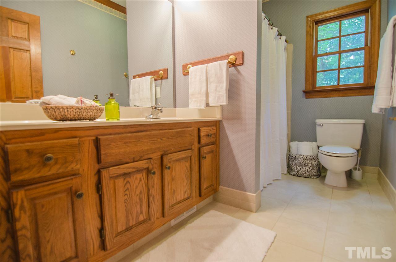 1301 Cool Spring Road Raleigh, NC 27614 - Photo 12 of 25 This bathroom has a tile floor. Make sure you see the cool cabinet on the wall inside the door.