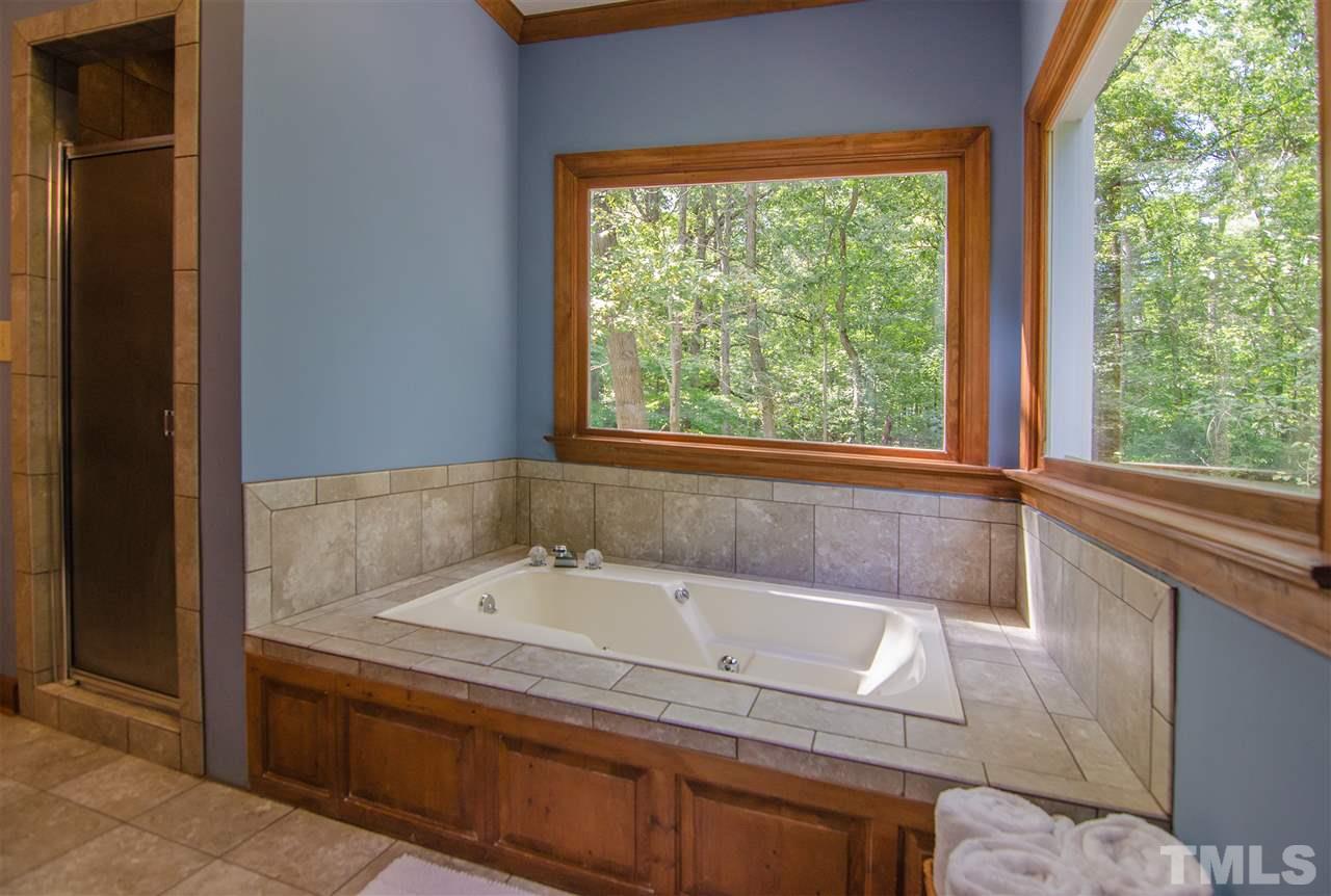 1301 Cool Spring Road Raleigh, NC 27614 - Photo 17 of 25 Updated bathroom with tile shower, tile surrounding the tub and tile floor.