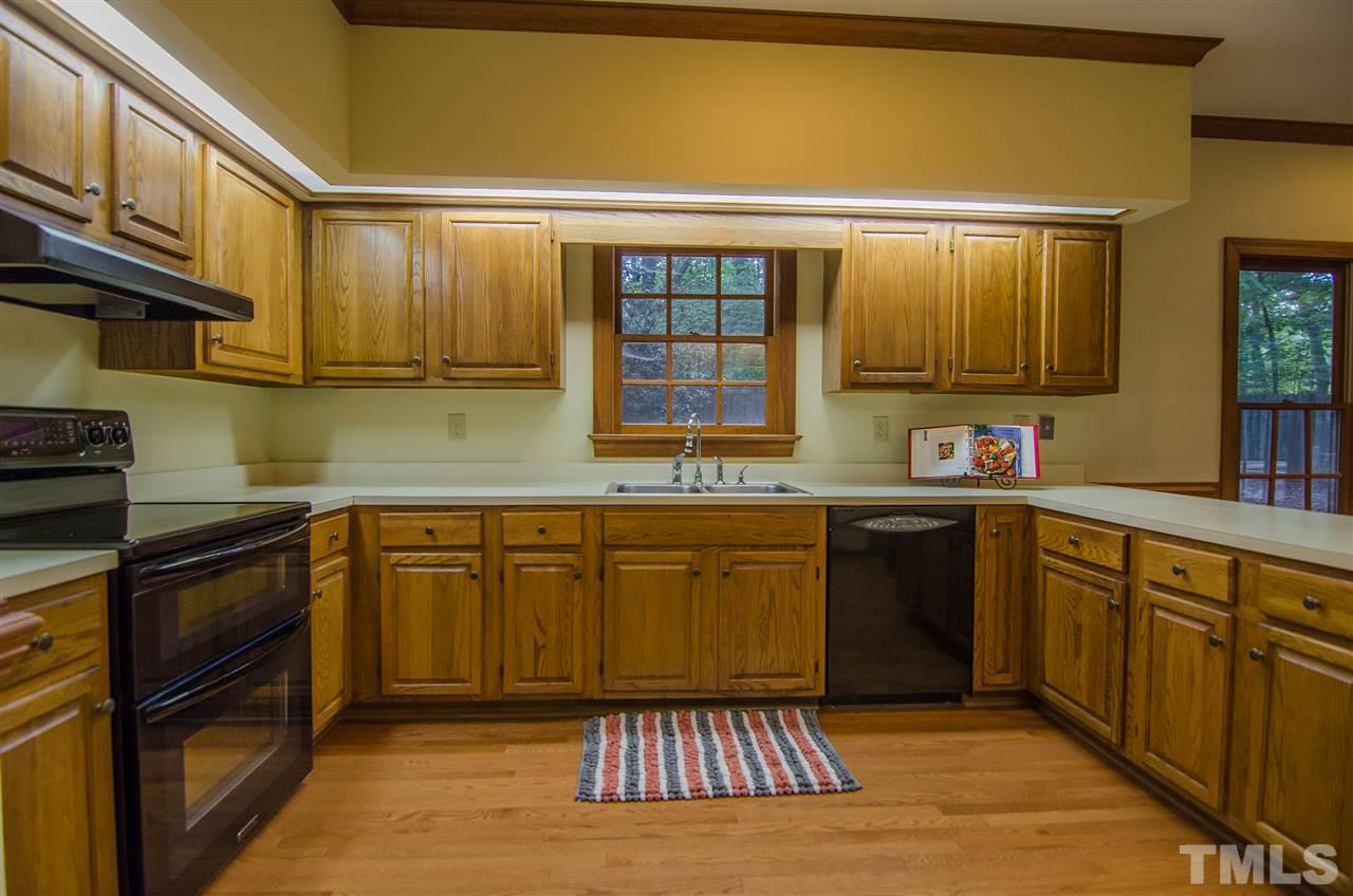 1301 Cool Spring Road Raleigh, NC 27614 - Photo 9 of 25 With lots of counter and cabinet space, this kitchen has a great design flow.